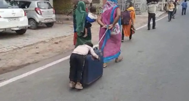 NHRC Notice To Punjab, UP and Agra DM over Migrant Mother Pulling a Suitcase with Her Child Sleeping Half-Hung Thereon